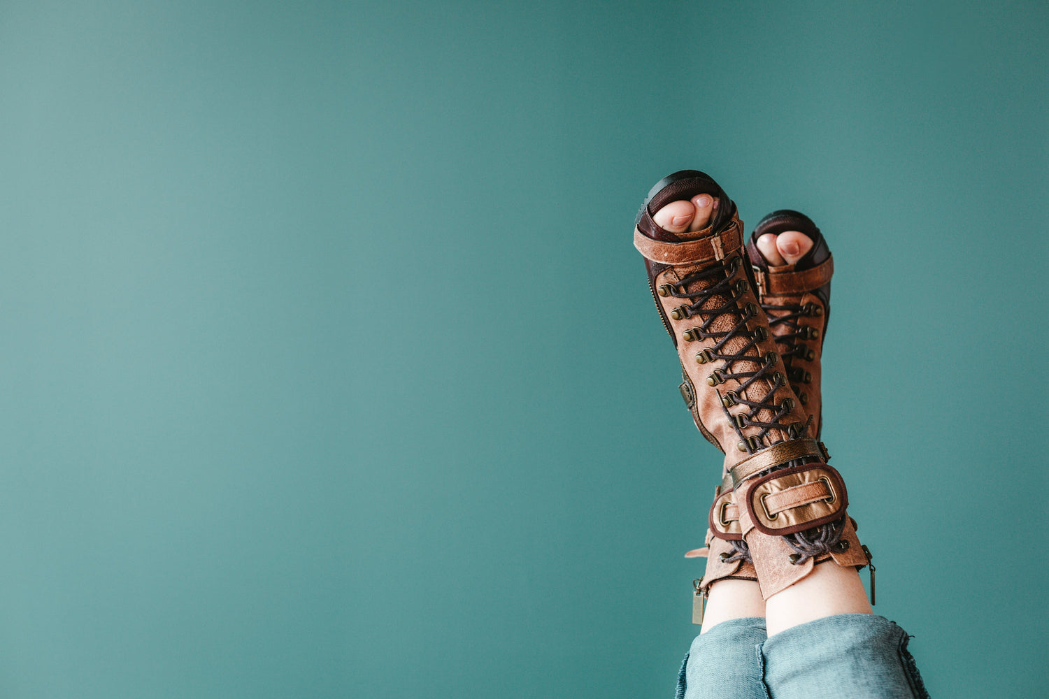 feet kicked up in the air showing shoes 