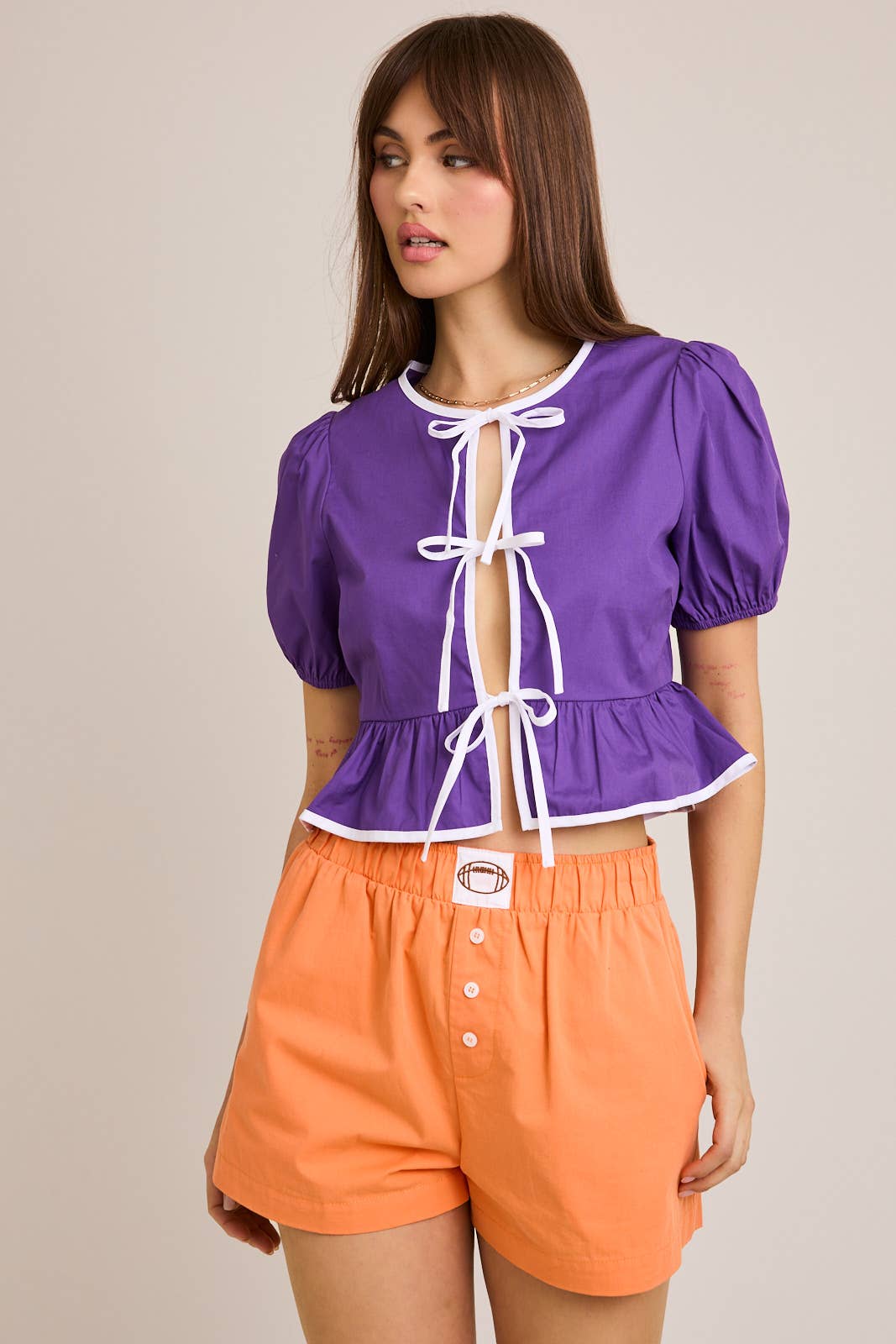 GAMEDAY PURPLE PUFF SHORT SLEEVE CONTRAST BOW DETAIL OPEN BLOUSE