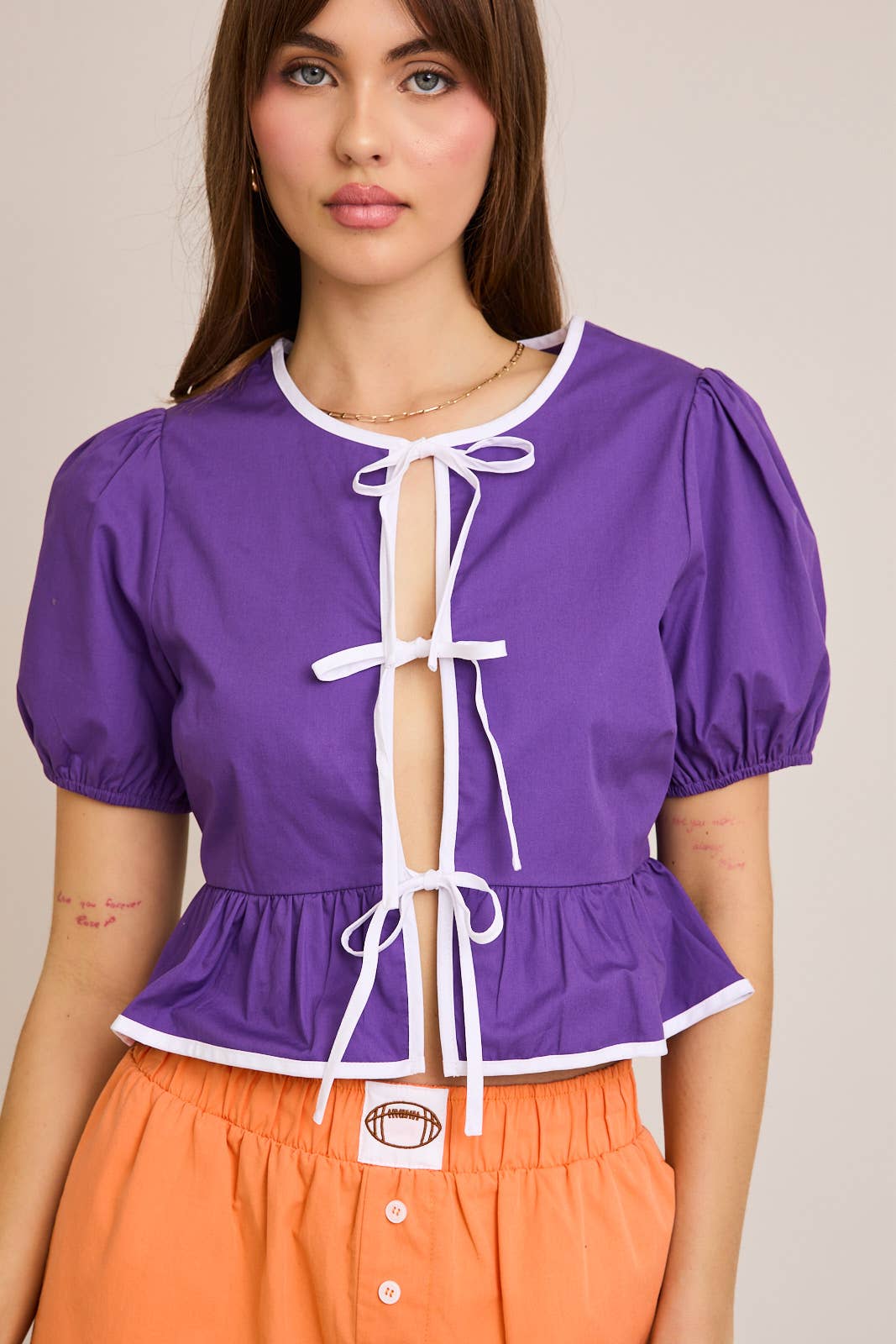 GAMEDAY PURPLE PUFF SHORT SLEEVE CONTRAST BOW DETAIL OPEN BLOUSE
